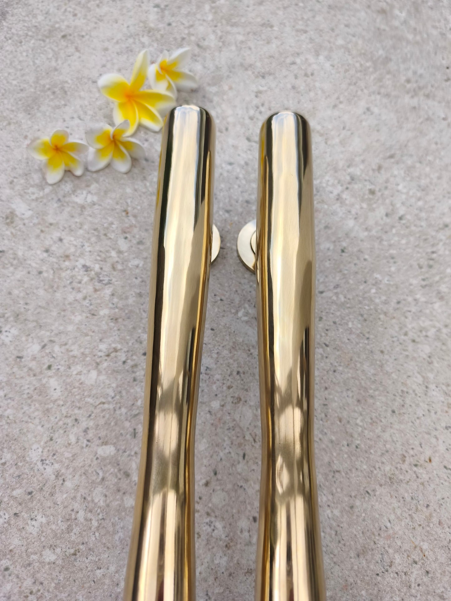 Top view of two 40 cm brass door handles, polished gold door pulls with a sleek minimalist design for modern entry doors and double doors