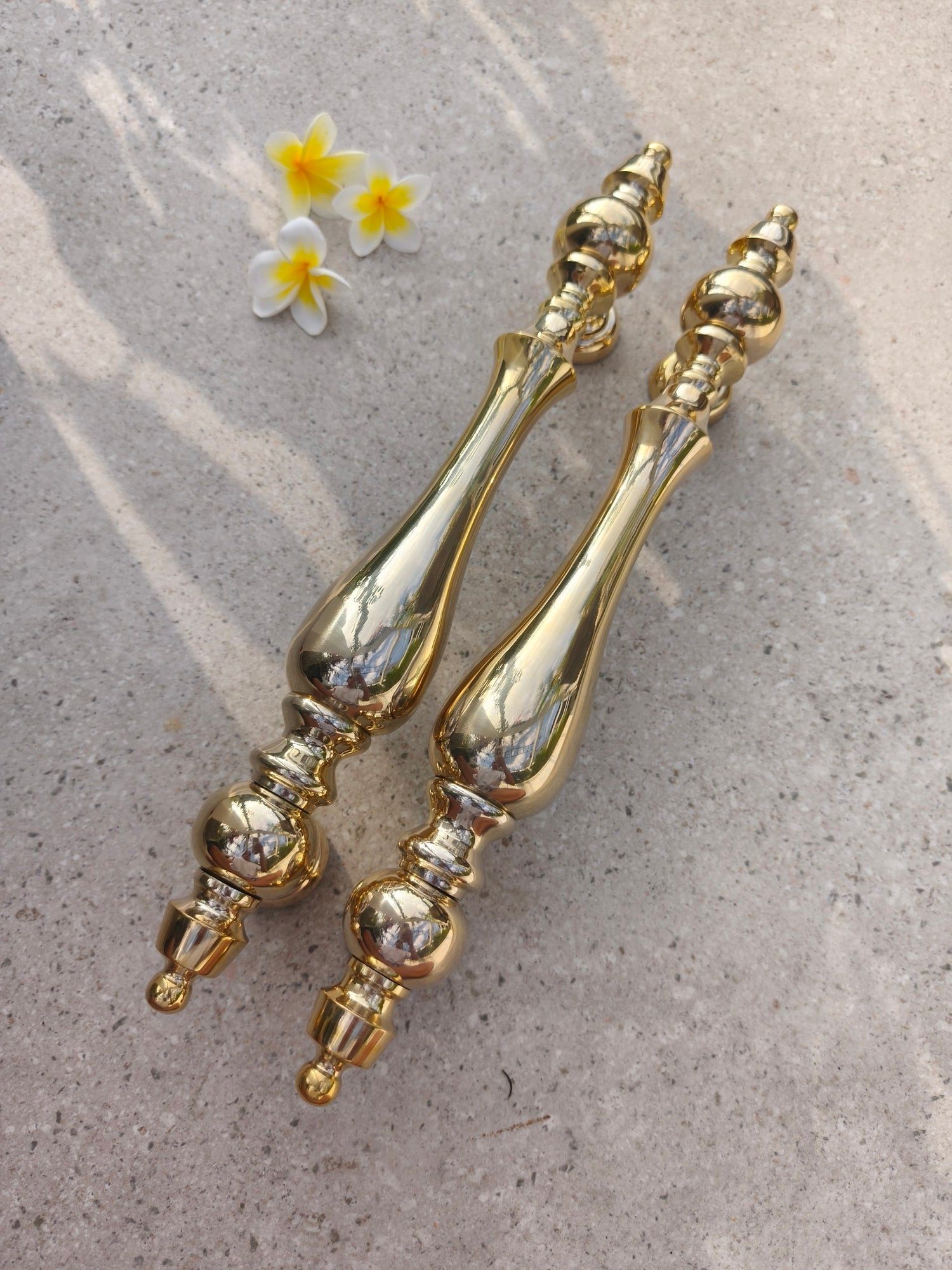 Ornate polished brass pull handle for a main door, heavy solid brass hardware with a warm gold shine, a statement piece for luxury homes, boutique hotels, restaurants and shop fronts