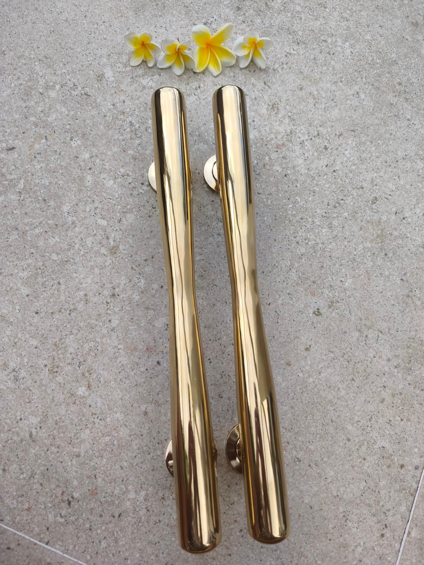 Two solid brass door pulls side by side, polished gold 40 cm tapered handles for modern, classic and tropical style front doors